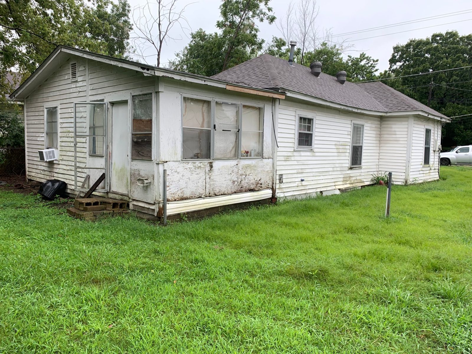 An as-is house in the River Valley we buy for cash — peeling paint, old windows, needs work